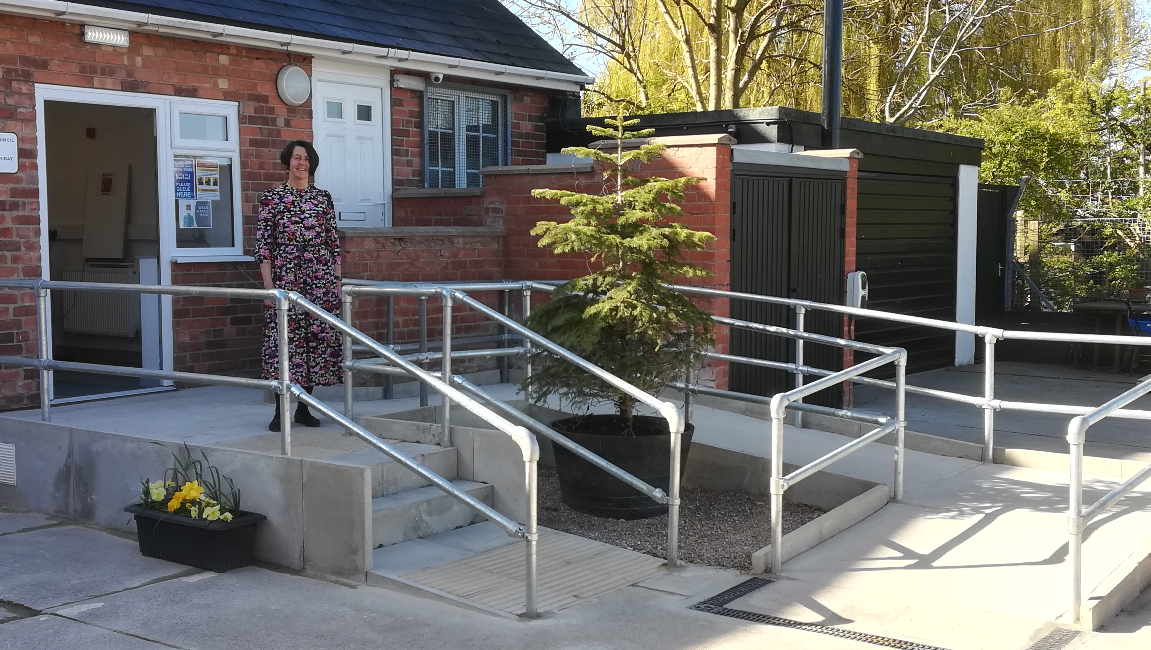 Parish Clerk outside the parish office